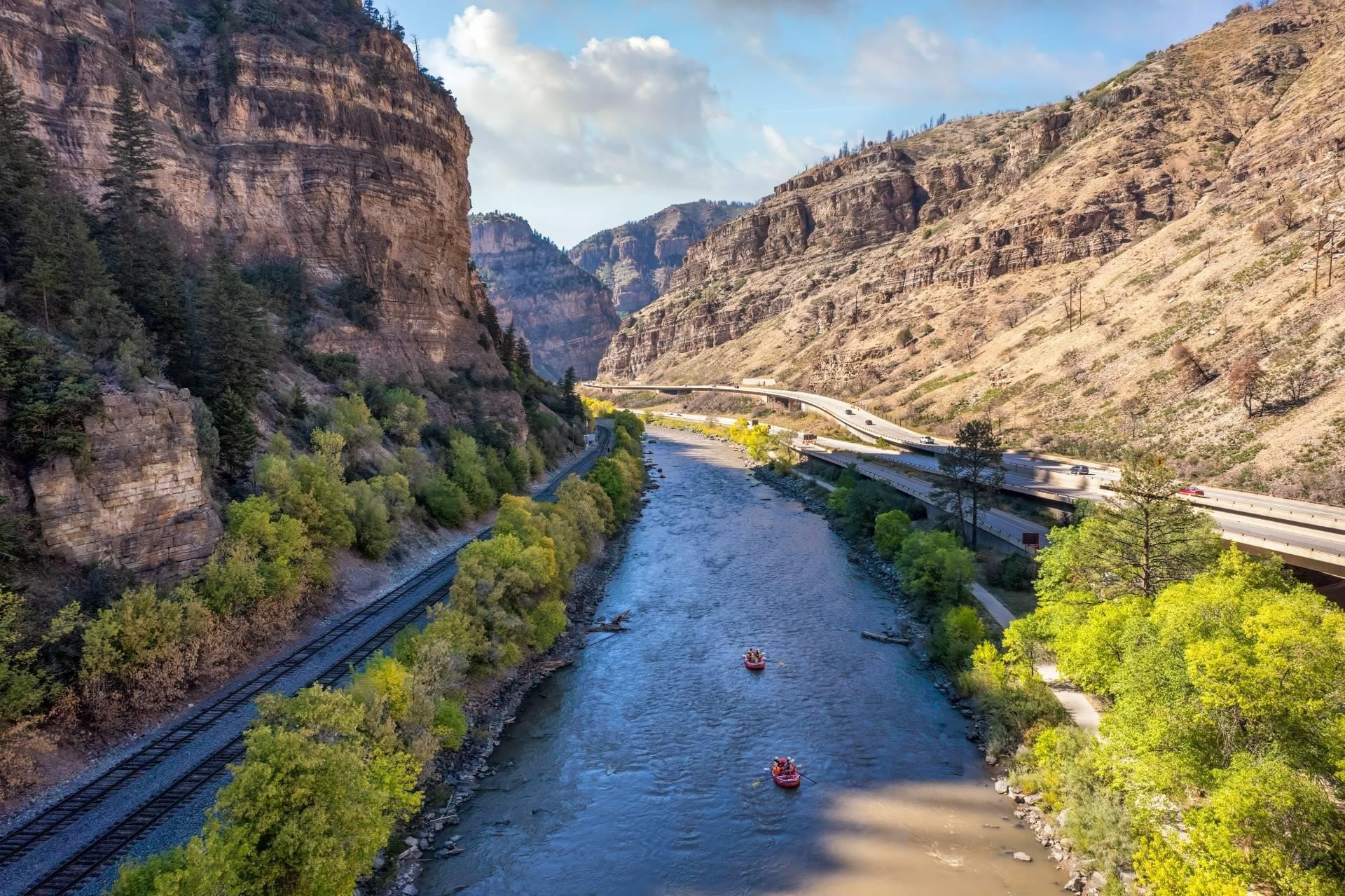 Railroad tracks and a highway next to the Colorado River